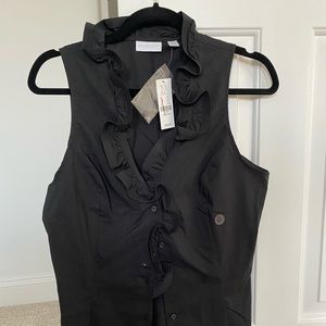 Button-up blouse with ruffles.